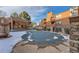 Community pool with a gazebo, seating, and metal perimeter fence with neighboring condo buildings at 4294 S Salida Way # 4, Aurora, CO 80013