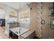 Elegant bathroom featuring a soaking tub with glass partition and mosaic tile shower at 20290 Doewood Dr, Monument, CO 80132