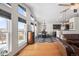 Bright dining room with a view, featuring hardwood floors, and a modern chandelier at 20290 Doewood Dr, Monument, CO 80132