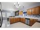 Spacious kitchen and dining room with stainless steel appliances and tile backsplash at 20290 Doewood Dr, Monument, CO 80132