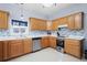 This bright kitchen has stainless steel appliances, light wood cabinets, and a tile backsplash at 20290 Doewood Dr, Monument, CO 80132