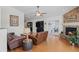 Relaxing living room with hardwood floors, a stone fireplace, and sliding doors to the patio at 20290 Doewood Dr, Monument, CO 80132