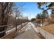 Paved pathway meanders through trees, perfect for walking or biking at 331 W Lehow Ave # 21, Englewood, CO 80110