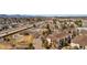 Community aerial view showcasing a pool, tennis court, manicured green spaces, and convenient highway access at 8422 S Upham Way # G47, Littleton, CO 80128