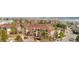 Wide aerial view showcasing a residential complex with mature trees, and neat landscaping at 8422 S Upham Way # G47, Littleton, CO 80128