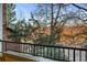 Cozy balcony view overlooking lush greenery and partial views of a quaint brick building at 8422 S Upham Way # G47, Littleton, CO 80128
