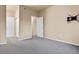 Bright bedroom with carpet flooring, closet, and mount for television at 8422 S Upham Way # G47, Littleton, CO 80128