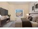Inviting bedroom featuring a large window, contemporary furniture, and cozy decorative touches at 8422 S Upham Way # G47, Littleton, CO 80128