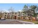 Charming condo building with brick accents, balcony, green space, and convenient parking at 8422 S Upham Way # G47, Littleton, CO 80128