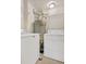 Convenient laundry room with washer, dryer, and shelving providing efficient storage solutions at 8422 S Upham Way # G47, Littleton, CO 80128