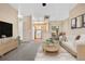 Inviting living room showcasing open-concept design with adjacent kitchen and dining areas for seamless entertaining at 8422 S Upham Way # G47, Littleton, CO 80128