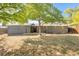Ranch home with a large backyard, freshly painted exterior and a patio at 34 University Dr, Longmont, CO 80503