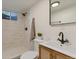 Basement bathroom with shower and vanity at 34 University Dr, Longmont, CO 80503