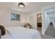 Bright bedroom with ensuite bathroom access and neutral decor at 34 University Dr, Longmont, CO 80503