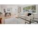 Living room features hardwood floors, comfy sofa, and large windows at 34 University Dr, Longmont, CO 80503