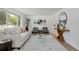 Living area with hardwood floors, comfy sofas, and large windows at 34 University Dr, Longmont, CO 80503