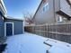 Side yard with shed and snow on the ground at 245 Dunhill St, Castle Rock, CO 80104