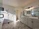 Elegant bathroom with double vanity, large mirror, and a walk-in shower at 245 Dunhill St, Castle Rock, CO 80104