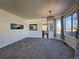 Bright dining room with carpeted floors and large windows at 245 Dunhill St, Castle Rock, CO 80104