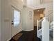 Bright entryway with dark hardwood floors and staircase at 245 Dunhill St, Castle Rock, CO 80104