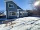 Two-story home with backyard and snow at 245 Dunhill St, Castle Rock, CO 80104