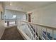 Upper level hallway with stairs, carpet, and access to bedrooms at 245 Dunhill St, Castle Rock, CO 80104