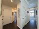 Clean and bright hallway with dark hardwood floors at 245 Dunhill St, Castle Rock, CO 80104