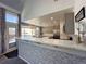 Modern kitchen with gray cabinets, quartz countertops, and island at 245 Dunhill St, Castle Rock, CO 80104