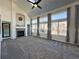 Bright living room with fireplace, vaulted ceiling and large windows at 245 Dunhill St, Castle Rock, CO 80104