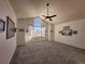 Main bedroom with vaulted ceiling, window seat and mountain views at 245 Dunhill St, Castle Rock, CO 80104