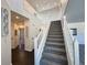 Elegant staircase with dark hardwood floors and white railings at 245 Dunhill St, Castle Rock, CO 80104