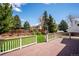 The home includes a spacious deck and sprawling lawn, all in a lush and private backyard at 7863 W Quarto Ave, Littleton, CO 80128