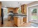 Well-equipped kitchen with stainless steel appliances, granite countertops, and ample cabinet space at 7863 W Quarto Ave, Littleton, CO 80128