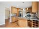 Modern kitchen boasting granite countertops, stainless steel appliances, and custom cabinetry for storage at 7863 W Quarto Ave, Littleton, CO 80128