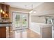Cozy eat-in kitchen with a beautiful view of the outdoor deck through elegant glass doors at 7863 W Quarto Ave, Littleton, CO 80128