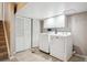 Functional laundry room featuring new washer and dryer, plus extra closet space for storage at 7863 W Quarto Ave, Littleton, CO 80128