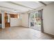 Living room with fireplace and sliding door access to the outdoor patio at 7863 W Quarto Ave, Littleton, CO 80128