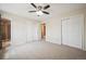 Main bedroom with plush carpet and ensuite bath at 7863 W Quarto Ave, Littleton, CO 80128
