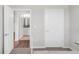 View of a bathroom with a door to another room at 155 S Monaco Pkwy # 302, Denver, CO 80224