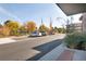 Parking lot with cars and landscaping at 155 S Monaco Pkwy # 302, Denver, CO 80224