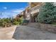 Stone patio area in the backyard with landscaping at 27485 E Nova Pl, Aurora, CO 80016