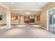 Open basement area with recessed lighting, wet bar, fireplace, and carpet flooring at 27485 E Nova Pl, Aurora, CO 80016