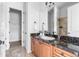 Bathroom featuring marble countertop, double doors, and walk in closet at 27485 E Nova Pl, Aurora, CO 80016