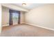 Carpeted bedroom with large window for natural light at 27485 E Nova Pl, Aurora, CO 80016