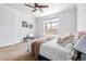 Bright bedroom featuring a ceiling fan and a large window providing ample natural light at 27485 E Nova Pl, Aurora, CO 80016