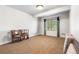 Carpeted bedroom with large window at 27485 E Nova Pl, Aurora, CO 80016