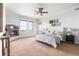 Spacious bedroom featuring large windows, fireplace, carpet flooring and neutral walls at 27485 E Nova Pl, Aurora, CO 80016