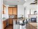 Kitchenette with granite countertops, bar seating, and cabinetry at 27485 E Nova Pl, Aurora, CO 80016