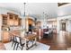 Gourmet kitchen boasts a large island, stainless appliances, and a dining area with plenty of storage at 27485 E Nova Pl, Aurora, CO 80016