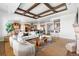 Bright and open living space seamlessly connecting to the dining and kitchen areas at 27485 E Nova Pl, Aurora, CO 80016